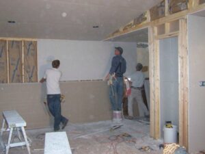 working installing drywall
